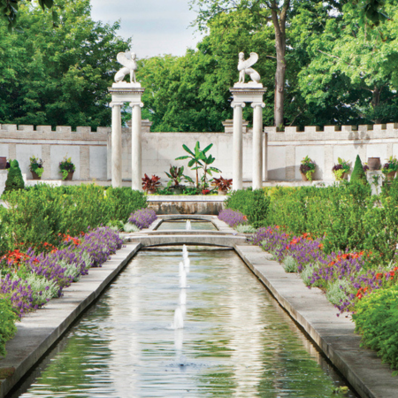 Photo of Untermyer Gardens, a long reflecting pool, and statues