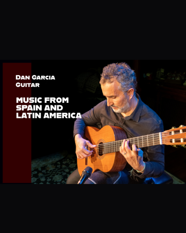 Man holding a classical guitar