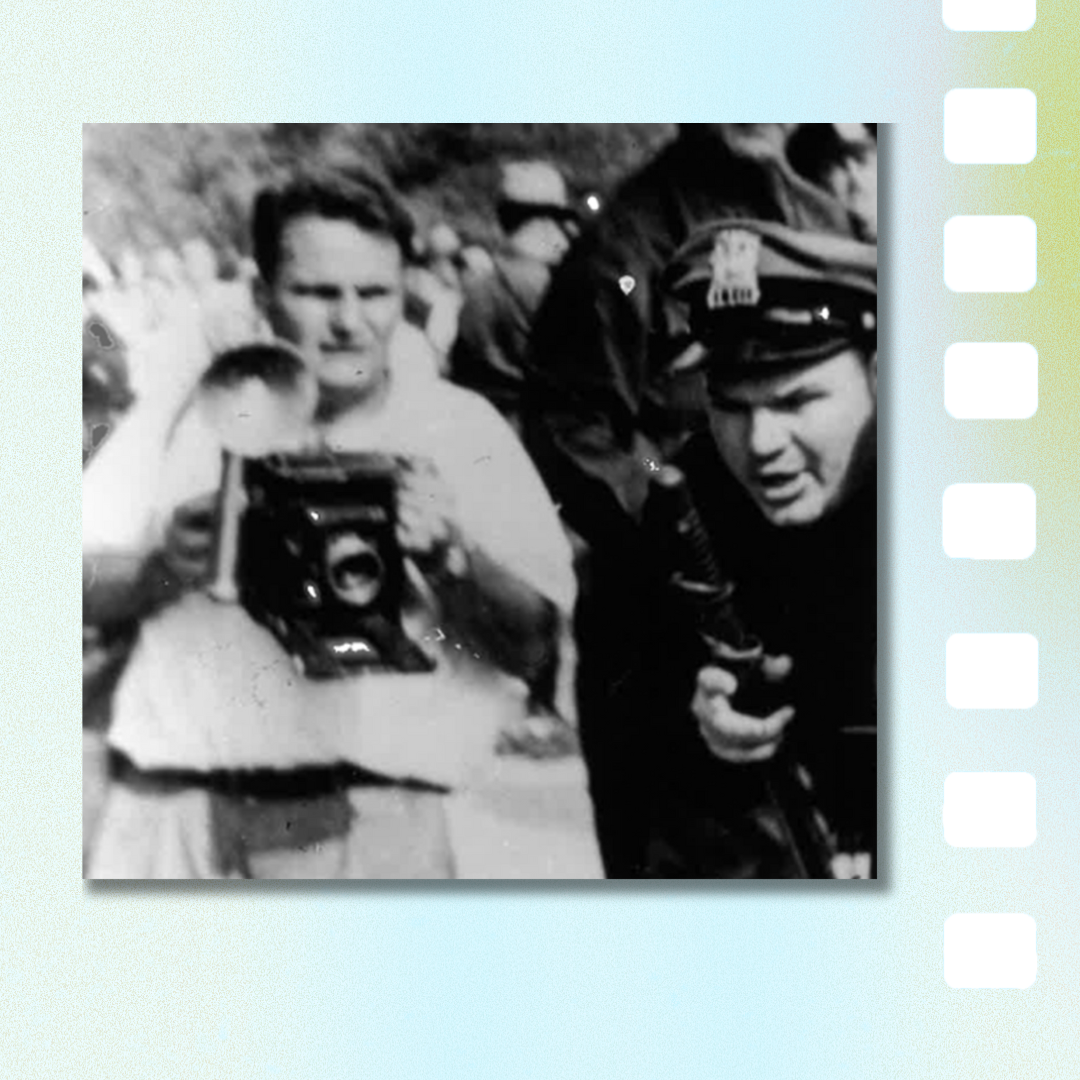 Old photo of a man with a camera