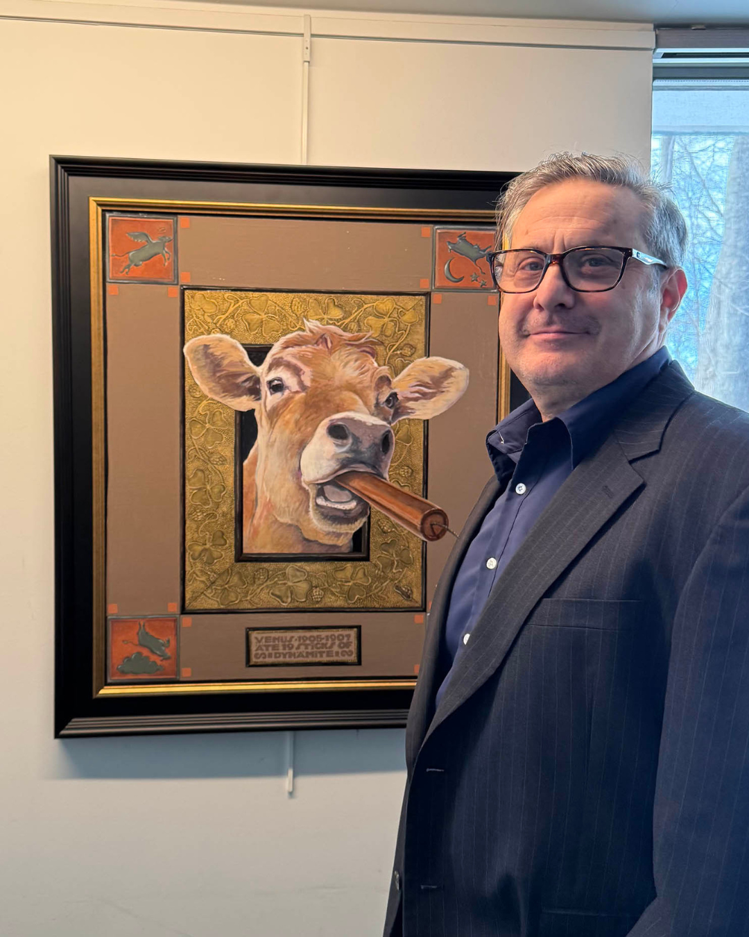 John Cote in front of a painting